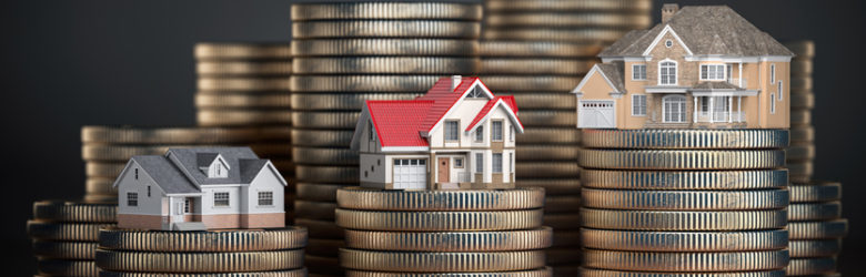 Houses of different size with different value on stacks of coins. Concept of property, mortgage and real estate investment.